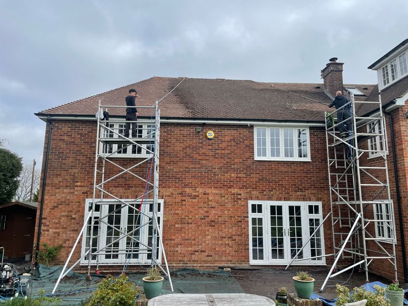 Roof cleaning carried out safely from scaffold towers by The Roof Moss Cleaners in Wraysbury